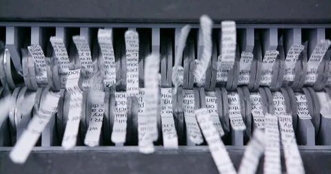 Sensitive document shredded through shredder close up of mechanical jaws Vídeo Stock 123733861