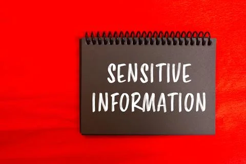 Sensitive information message written on black notebook page with red backgro 스톡 사진