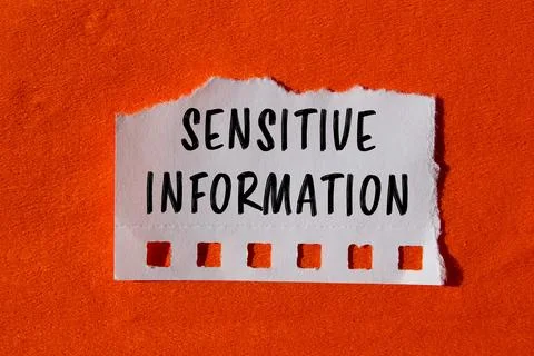 Sensitive information message written on ripped torn paper background. Conc.. Stock Photos