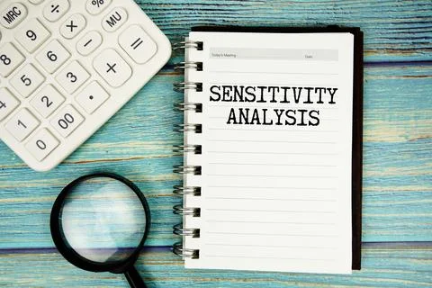 Sensitivity Analysis text on notepad with magnifying glass and calculator o.. Stock Photos