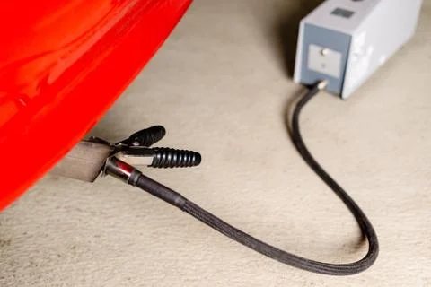 Sensor device measuring exhausts of a car in garage Stock Photos