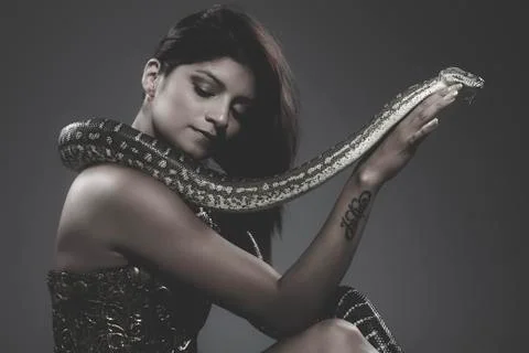 Sensual beautiful latin woman with python snake Stock Photos