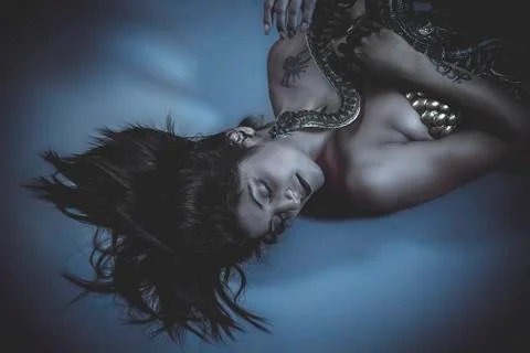 Sensual beautiful latin woman with python snake Stock Photos