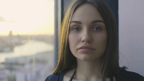 Sensual brunette is standing next to the window Stock Footage 90472962