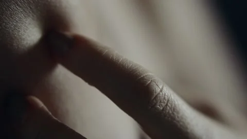 A sensual close-up of a woman's hand wandering over the body Stock Footage 166319660