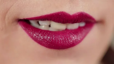 Sensual close-up of woman’s lips adorned with glossy red makeup Stock Footage 311894438