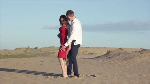 Sensual couple in desert Stock Footage 78156186