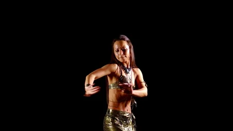Sensual female dancer is dancing oriental dance in dark room, moving by hands Stock Footage 109490333