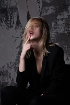 Sensual girl posing at studio with shadows Stock Photos