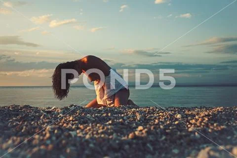 Sensual girl with sexy body relax on beach. Sexy woman sit on sand with naked Stock Photos