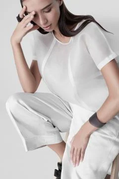 Sensual model in white modern clothes Stock Photos