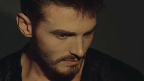 Sensual passionate look at camera of handsome man on background Stock Footage