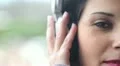 sensual woman listening to music while looking al the camera HD Footage