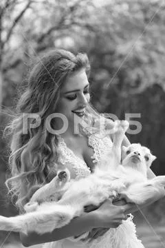 Sensual woman with small goat Stock Photos