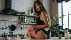 Lingerie Woman in Tight Dress Flirting in Kitchen Showing Stock Video -  Video of flour, body: 95811611