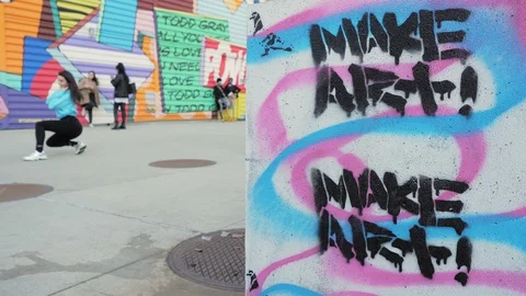 Sentence “Make art” written on a wall Stock Footage 129451434