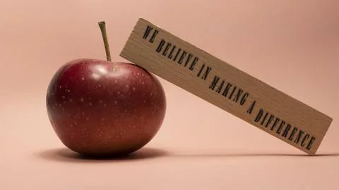 The sentence We believe in making a difference was written. Wooden concept .. Foto stock