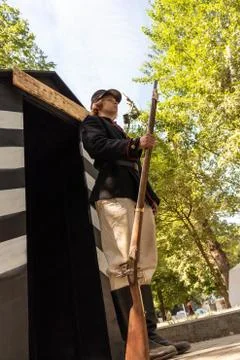 A sentry soldier stands at the post with a gun in his hand. World War I. Фото
