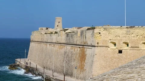 Sentry turret perches on fort st elmo bastion wall close view limestone rampart Stock Footage 341806371