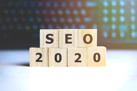Seo 2020 concept. Wooden cubes on a black keyboard Stock Photos