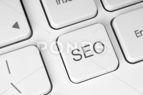 Seo button on the keyboard Stock Photos