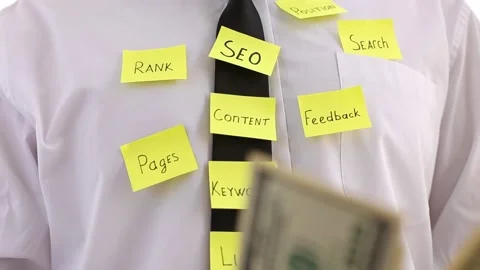 SEO optimization, notes on tie and white shirt of an office worker. Stock Footage 136033699