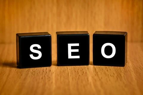 Seo or search engine optimization word on black block Illustrazione stock