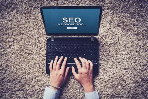 SEO positioning work with a laptop, with hands typing on the keyboard. Foto stock