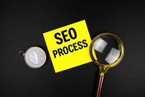 SEO Process text message on sticky note with magnifying glass and compass o.. Stock Photos