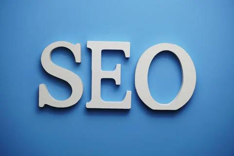 SEO Search Engine Optimization alphabet letter on blue background Stock Photos