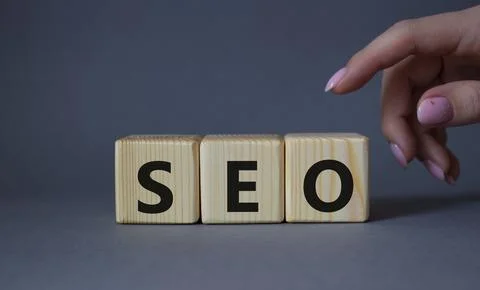 SEO - Search Engine Optimization symbol. Wooden blocks with words SEO. Busi.. Stock Photos