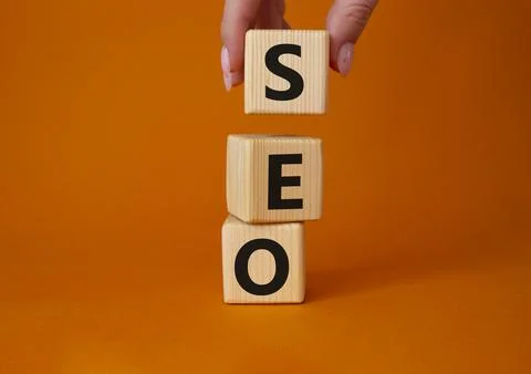 SEO - Search Engine Optimization symbol. Wooden blocks with words SEO. Busine Stock Photos