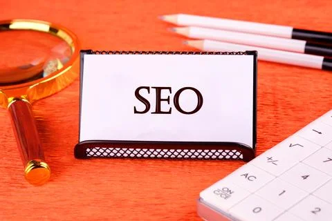 SEO Search Engine Optimization symbol there is a magnifying glass, a calculat Foto stock