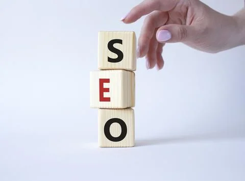 SEO - Search Engine Optimization symbol. Wooden blocks with words SEO. Busi.. Stock Photos