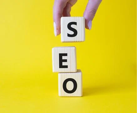 SEO - Search Engine Optimization symbol. Wooden blocks with words SEO. Busine 写真素材