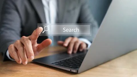 SEO Search Engine Optimization, Young Man Using laptop and tablet To Find I.. Stock Photos