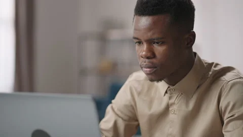 Seo specialist is working with notebook, closeup portrait of face, black man is Stock-Footage 150659702