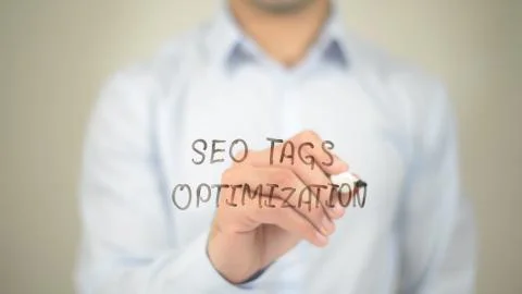 SEO Tags Optimization,  Man writing on transparent screen Foto stock