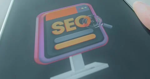 SEO text on computer screen under magnifying glass, presentation Stock Footage 313441112