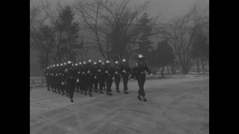 SEOUL - 1952: Marching drill - Boots cross a wintry parade yard Stock Footage 344500012