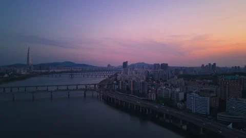 Seoul Blue Hour Aerial Pullback Over Han River with Lotte Tower and Stock Footage 334767740