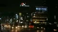 Seoul Neon Street Electronic by night, Asian Shopping, Shoppers in South Korea HD Footage