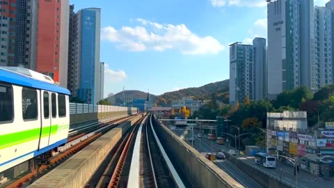 Seoul, October 8, 2025. Elevated train to Lotte World passes through high-rise Video stock 318660590