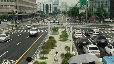 Seoul - People and traffic at junction near Seoul station. Speed up. Stock Footage