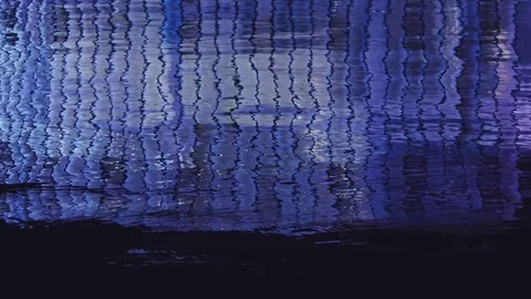 Seoul - Reflection in water of Some Sevit glass building glowing at night. Stock Footage 78592285