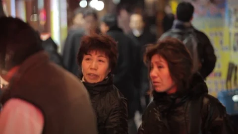 Seoul sci fi street with glowing signs and pedestrians tilt to signage Stock Footage 100596145