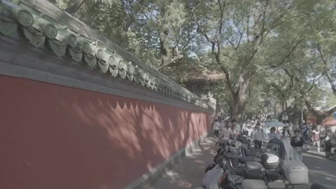 SEP 14.2026.CHINA.Red Wall and Glazed Tile Eaves of Historic Temple in Beijing Stock Footage 345470853