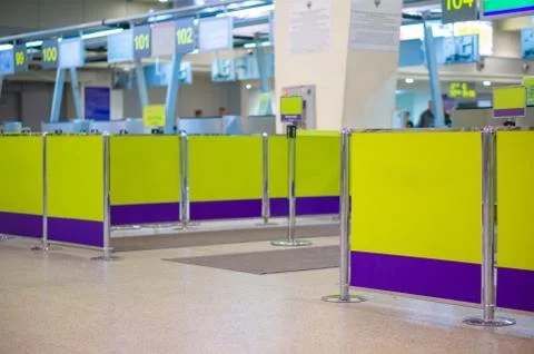 Separate business class check in gates with borders at airport Stock Photos