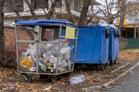 Separate collection of garbage in containers on a city street for recycling Stock Photos