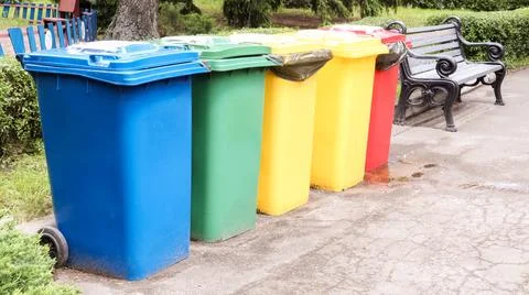 Separate containers for garbage collection in the park. Multi-colored stree.. 스톡 사진